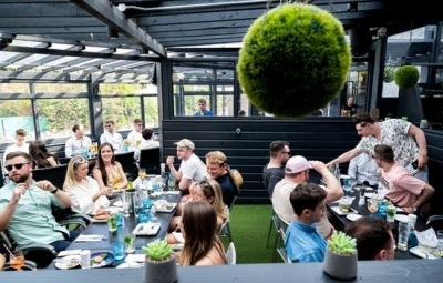 Guests dining on Azzurro's covered terrace